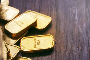 Gold bars on wood table