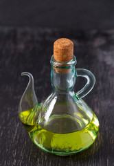 olive oil on dark wooden surface