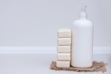 Liquid and soap bar on the white background. Copy space