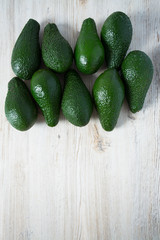 avocado on white wooden surface