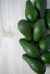avocado on white wooden surface
