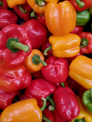Orange , red & yellow peppers background 