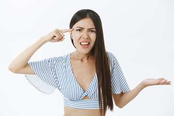 You out of your mind. Pissed and irritated girlfriend having argument yelling standing confused and...