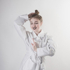 portrait of a young girl in a white coat