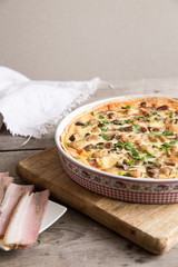 Homemade quiche lorraine with chicken, mushrooms, cheese and bacon. Tart with chicken. Chicken pie. Mushroom pie