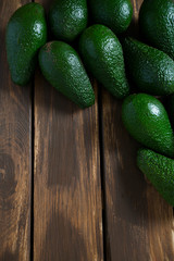 avocado on dark wooden surface
