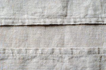 Woven linen fabric showing the stitching