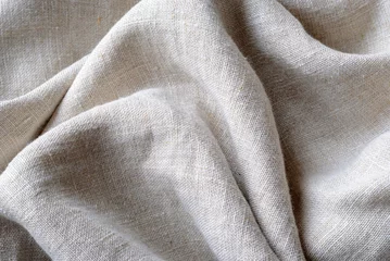  Verzamelde en gevouwen textuur van geweven linnen stof © sergign