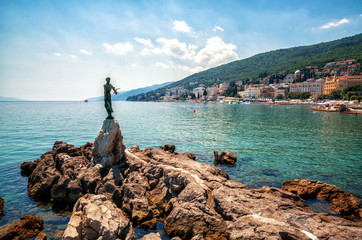 The historic statue of Maiden with the seagull is a symbol, not only of Opatija, but the entire Kvarner region. The statue on Adriatic coast is in the touristic town of Opatija in Croatia, Europe © InfiniteFlow