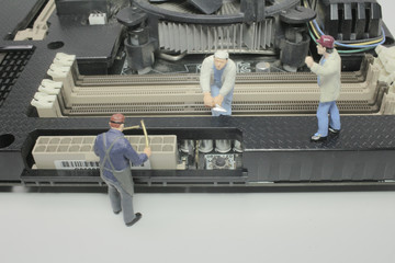 a Worker team of engineers repairing compute