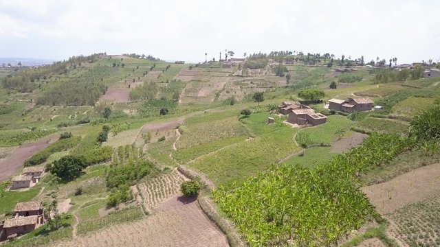 View over African village huts and green landscape