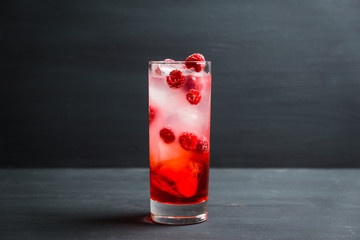 Sweet raspberry Tom collins cocktail. Selective focus. Shallow depth of field.