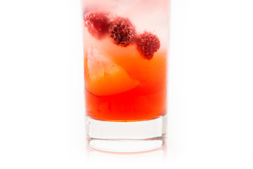 Sweet raspberry Tom collins cocktail isolated on white background. Selective focus. Shallow depth of field.