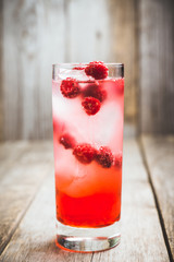 Sweet raspberry Tom collins cocktail. Selective focus. Shallow depth of field.