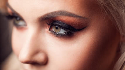 Female eye with evening makeup, close-up. Bright makeup