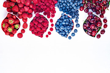 Collection of berries on white background. Fruits diet concept. Top view, Various fresh summer berries.. Food concept. Flat lay. Nature concept. A place for your inscription.