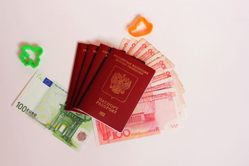 The passport of the Russian Federation. Biometric russian passports and euro and yuan for the trip.