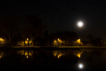 Fototapeta na wymiar River at night against the moon