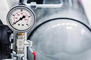 pressure gauge for measuring installed in water or gas systems. Plumbing, fixing pipes and fittings...