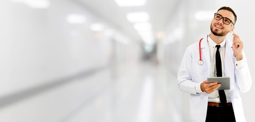 Doctor using tablet computer at the hospital. Medical healthcare and doctor staff service.