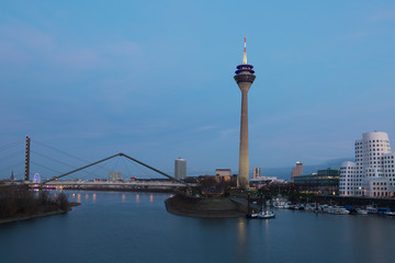 Fototapeta na wymiar Media harbor with Rheinturm tower at night in Dusseldorf, Germany