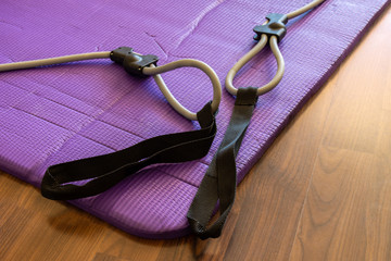 expander on a fitness mat