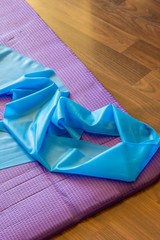 elastic expander on a fitness mat
