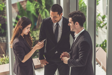 Businesswoman executive is in meeting discussion with businessmen or client in modern workplace office. People corporate business team concept.