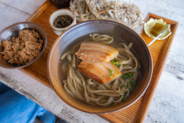 Okinawa Soba noodles with pork soft bone broth. Fire noodles with pork belly and Japanese soup