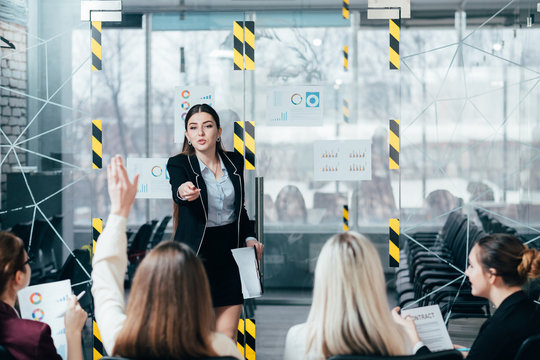 Marketer team. Company advanced training. Coach answering questions of participants.