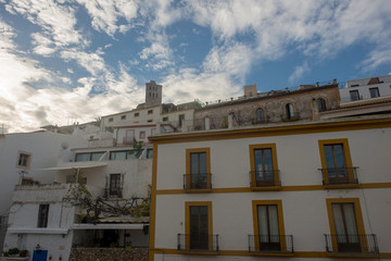 Fototapeta na wymiar White houses around the town of Ibiza