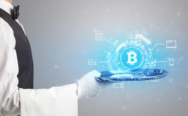 Waiter serving on a tray cryptocurrency and mining concept
