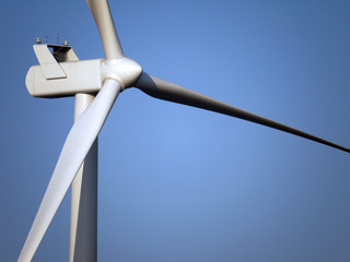 Wind farm generator tower and rotor blades assembly.