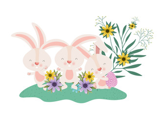easter rabbits with eggs and flowers icon