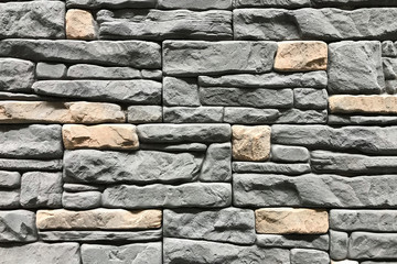 Stone wall with a grey color. Concept interior design background and texture