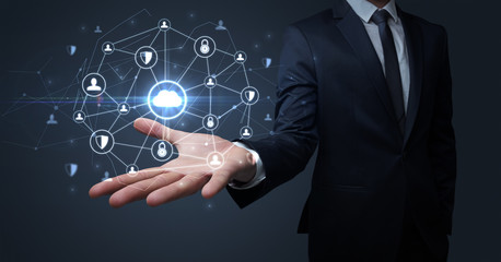 Businessman holding networking connection concept with dark wallpaper