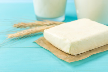 Butter on blue wooden background.