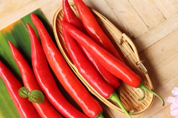 Red chili for cooking on wood background