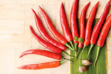 Red chili for cooking on wood background