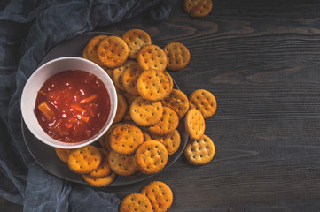 Dry thin crackers with tomato sauce 