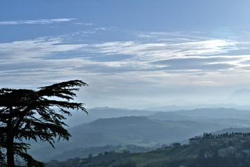 view of mountains,hills,fog,landscape,panorama,italy,sky,blue,clouds,tree