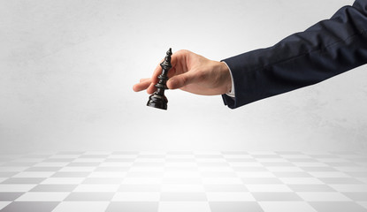 Big elegant hand taking his next step on chess game
