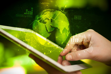 Hand using tablet with multinational worldwide estate report concept
