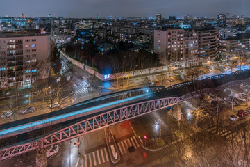 Fototapeta na wymiar Subway bridge at night in Paris, France