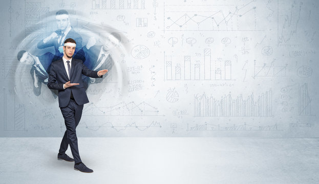 Young businessman in suit fighting with chart and report concept
