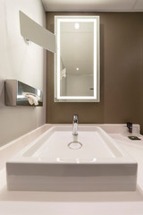 Fototapeta na wymiar Interior of a modern hotel bathroom with a mirror