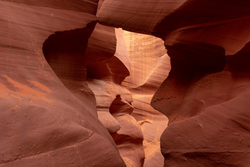 Obraz na płótnie Canvas Lower Antelope Canyon - guided tour to scenic, twisting, narrow, sandstone and limestone walls of winding slot canyon curved by flash flood in American Southwest, Navajo Tribal Park, Page, Arizona