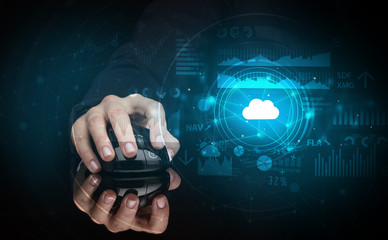 Hand using wireless mouse with cloud technology concept and dark background
