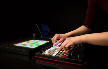 Fototapeta premium Dj hand remixing music on midi controller 