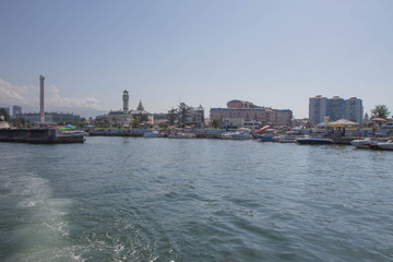 Obraz premium The city embankment, View From Sea. View From Sea Of Embankment Of The Georgian Resort Town